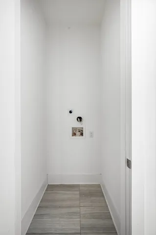 a view of a small space with wooden floor