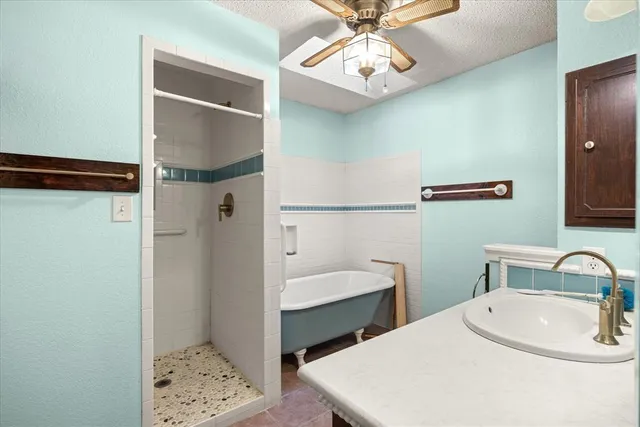 a en suite bathroom with a sink and a mirror