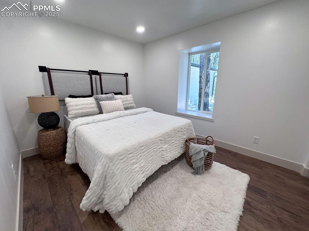 14546 Pine View Road Larkspur, CO 80118 - Photo 22 of 37 Bedroom featuring wood finished floors and recessed lighting