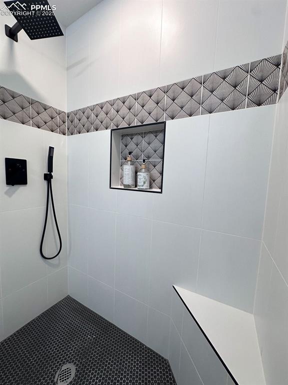 14546 Pine View Road Larkspur, CO 80118 - Photo 24 of 37 Bathroom with a tile shower