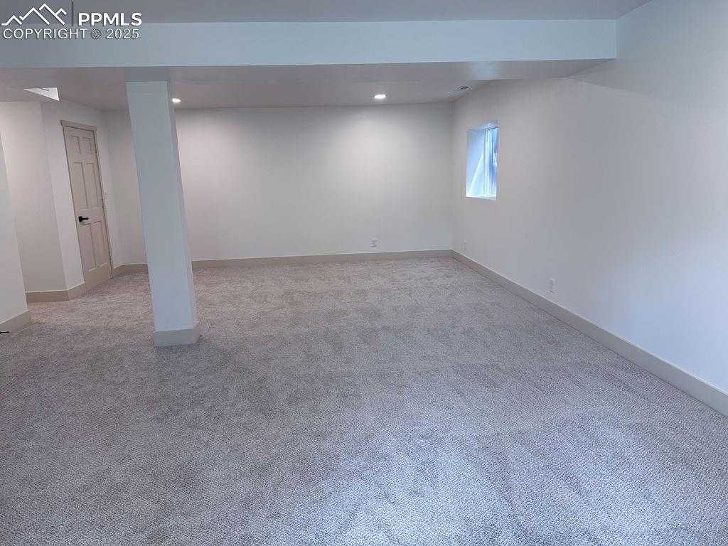 14546 Pine View Road Larkspur, CO 80118 - Photo 29 of 37 Below grade area with light carpet and recessed lighting