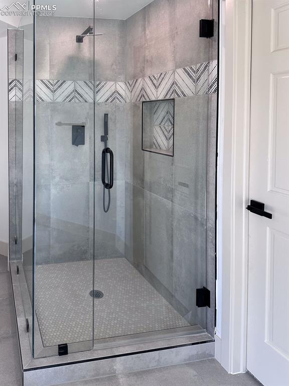 14546 Pine View Road Larkspur, CO 80118 - Photo 31 of 37 Full bathroom with a stall shower