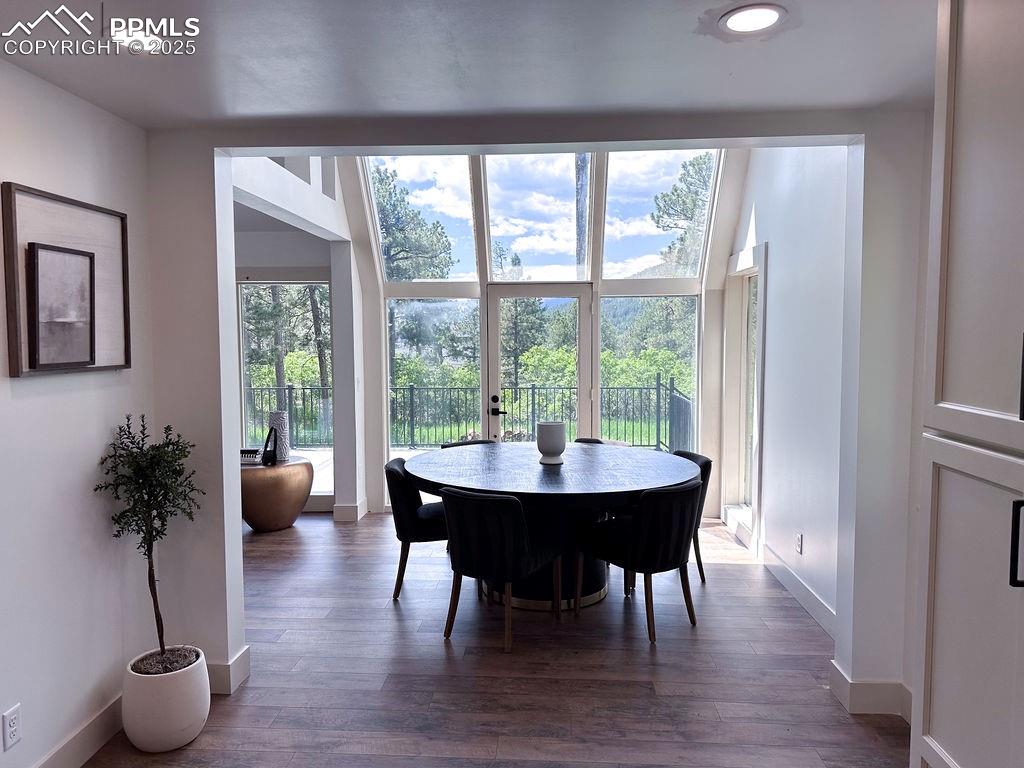 14546 Pine View Road Larkspur, CO 80118 - Photo 10 of 37 Dining area featuring dark wood finished floors and recessed lighting