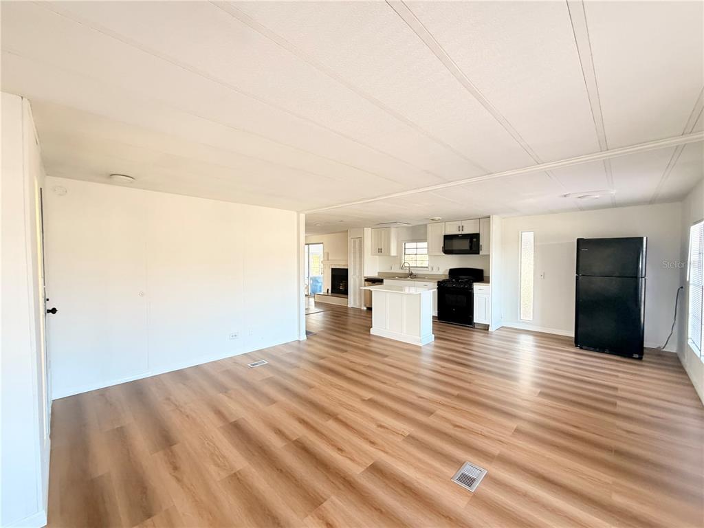 26352 Mc Allister Street Brooksville, FL 34602 - Photo 26 of 26 a view of empty room with wooden floor