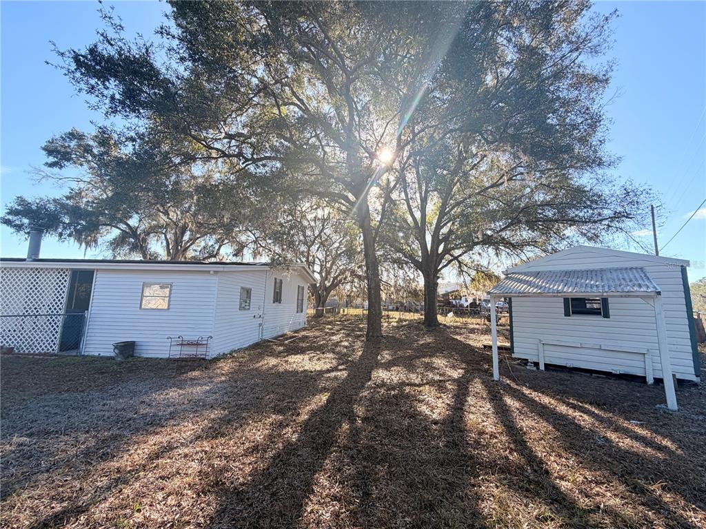 26352 Mc Allister Street Brooksville, FL 34602 - Photo 9 of 26 a view of a wooden fence
