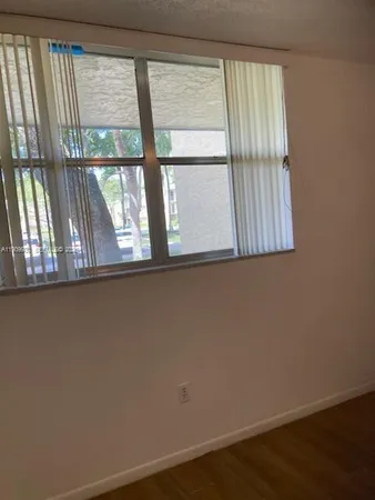 a view of a window in an empty room
