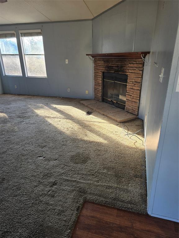 1903 VZ County Road Ben Wheeler, TX 75754 - Photo 15 of 35 a view of empty room with wooden floor and fireplace
