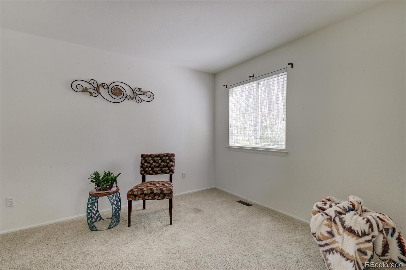 5555 South Rome Street Aurora, CO 80015 - Photo 20 of 34 a room with a window and a table