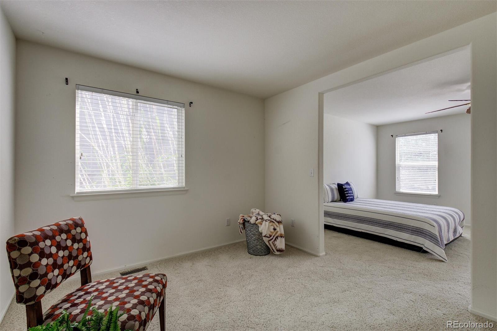 5555 South Rome Street Aurora, CO 80015 - Photo 21 of 34 a bedroom with bed and a window