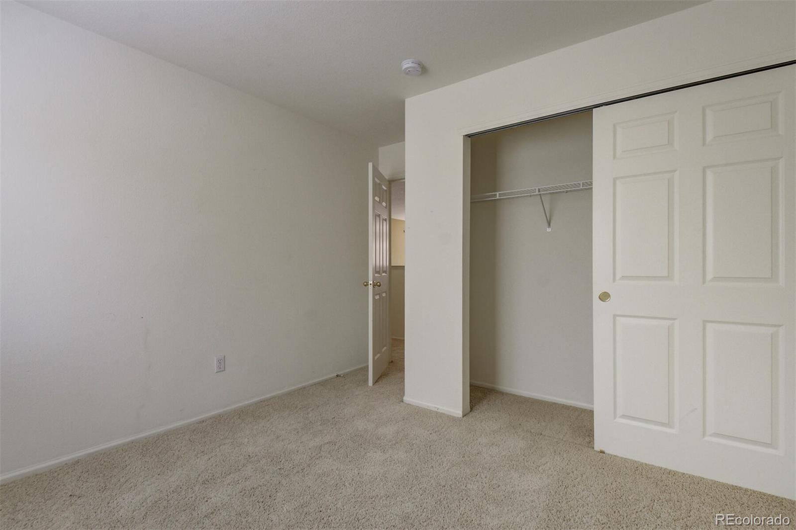 5555 South Rome Street Aurora, CO 80015 - Photo 24 of 34 an empty room with closet area