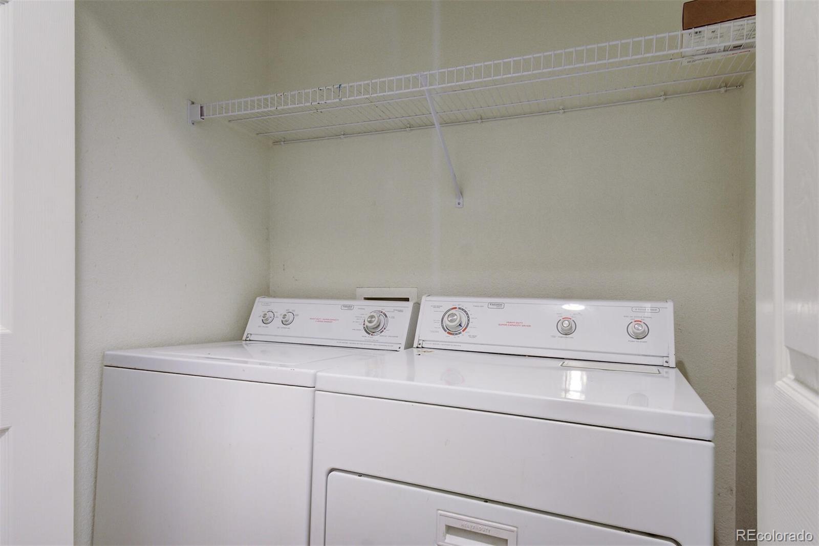 5555 South Rome Street Aurora, CO 80015 - Photo 26 of 34 a utility room with dryer and washer