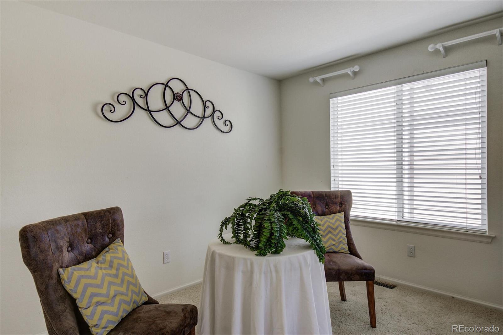 5555 South Rome Street Aurora, CO 80015 - Photo 9 of 34 a view of a room with furniture and a window