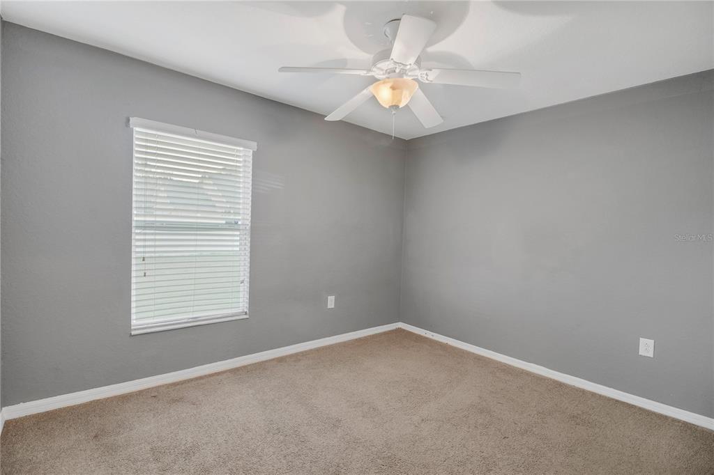 314 Stone Castle Loop Lady Lake, FL 32159 - Photo 34 of 42 an empty room with a window