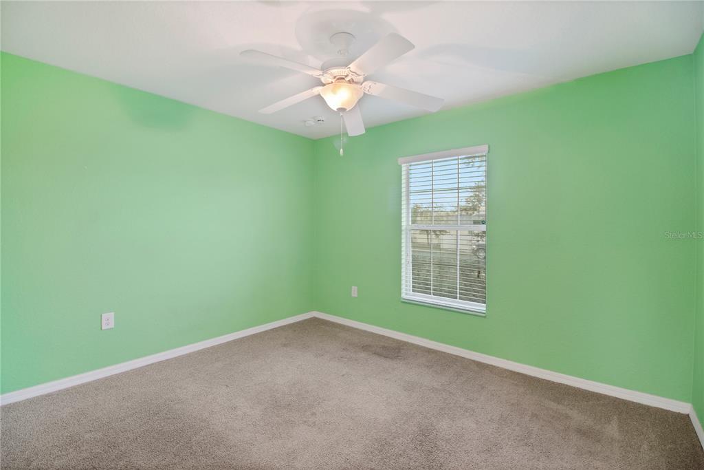 314 Stone Castle Loop Lady Lake, FL 32159 - Photo 38 of 42 an empty room with window and fan
