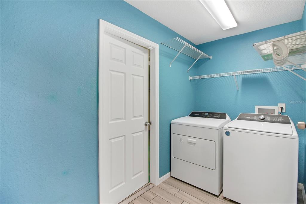 314 Stone Castle Loop Lady Lake, FL 32159 - Photo 40 of 42 a utility room with dryer and washer