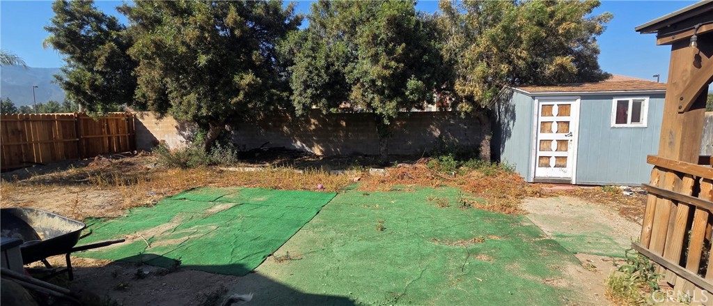 1548 Ranch Road San Bernardino, CA 92407 - Photo 25 of 26 a view of a backyard with a tree
