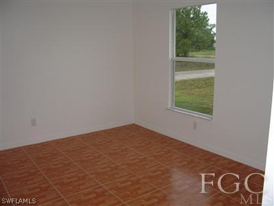 2134 Armour Road Lehigh Acres, FL 33973 - Photo 8 of 10 an empty room with window