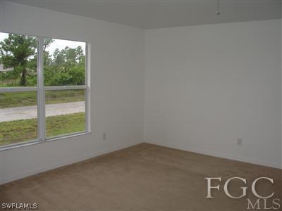 2134 Armour Road Lehigh Acres, FL 33973 - Photo 9 of 10 a view of an empty room with a window