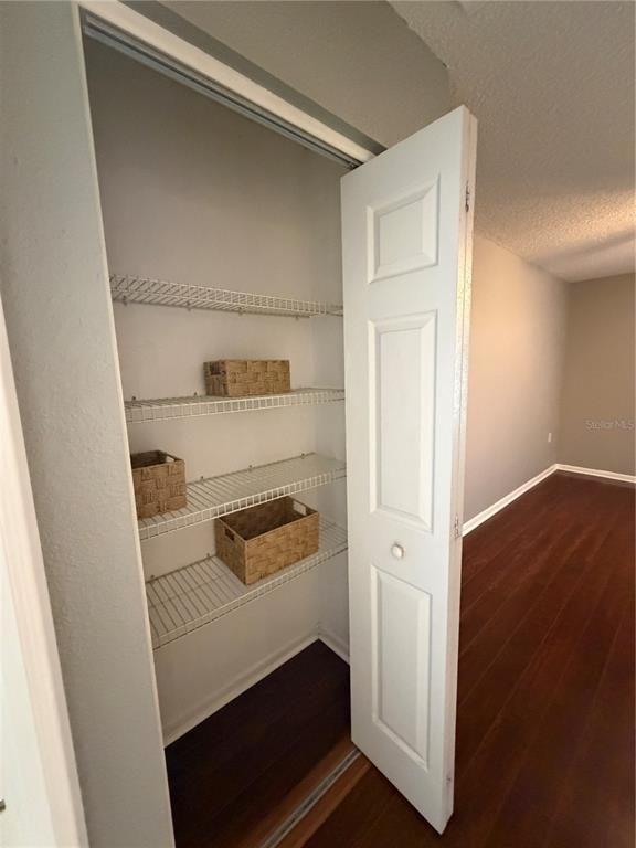 2131 Ridge Road South, Unit 135 Largo, FL 33778 - Photo 25 of 33 a kitchen with a white stove and a refrigerator