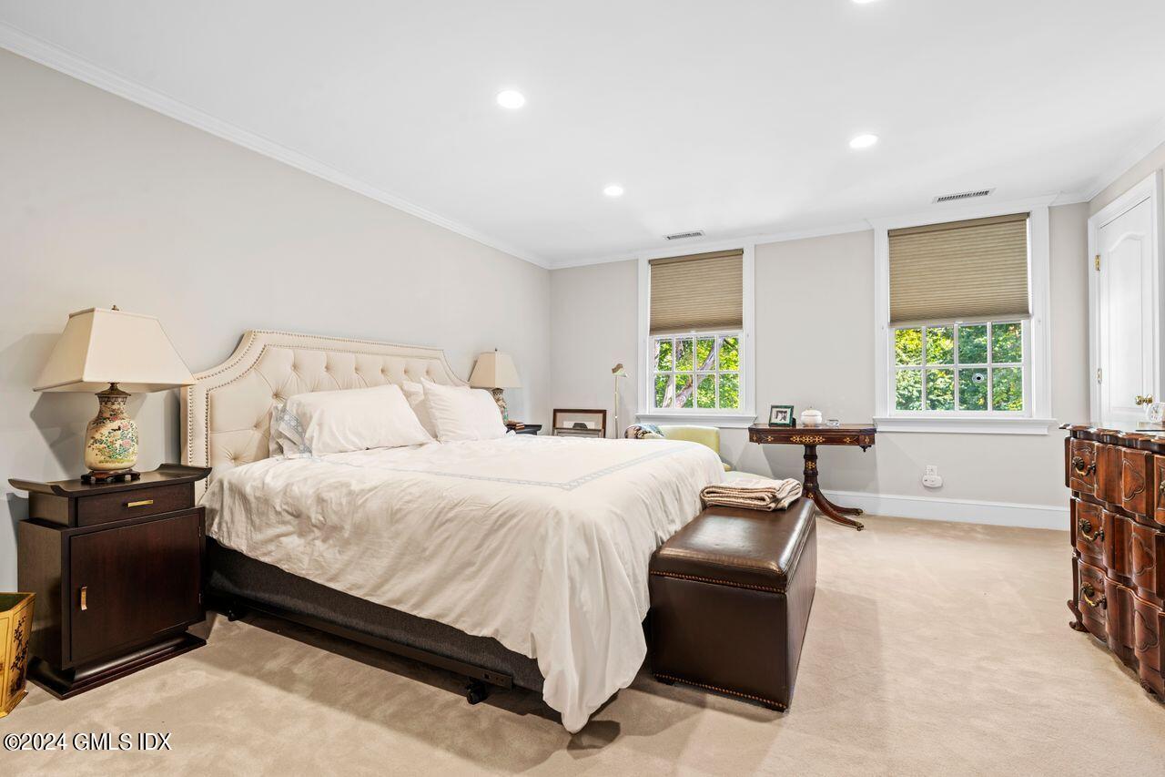 43 Maple Avenue, Unit 2 Greenwich, CT 06830 - Photo 7 of 17 a bedroom with a bed and a large window