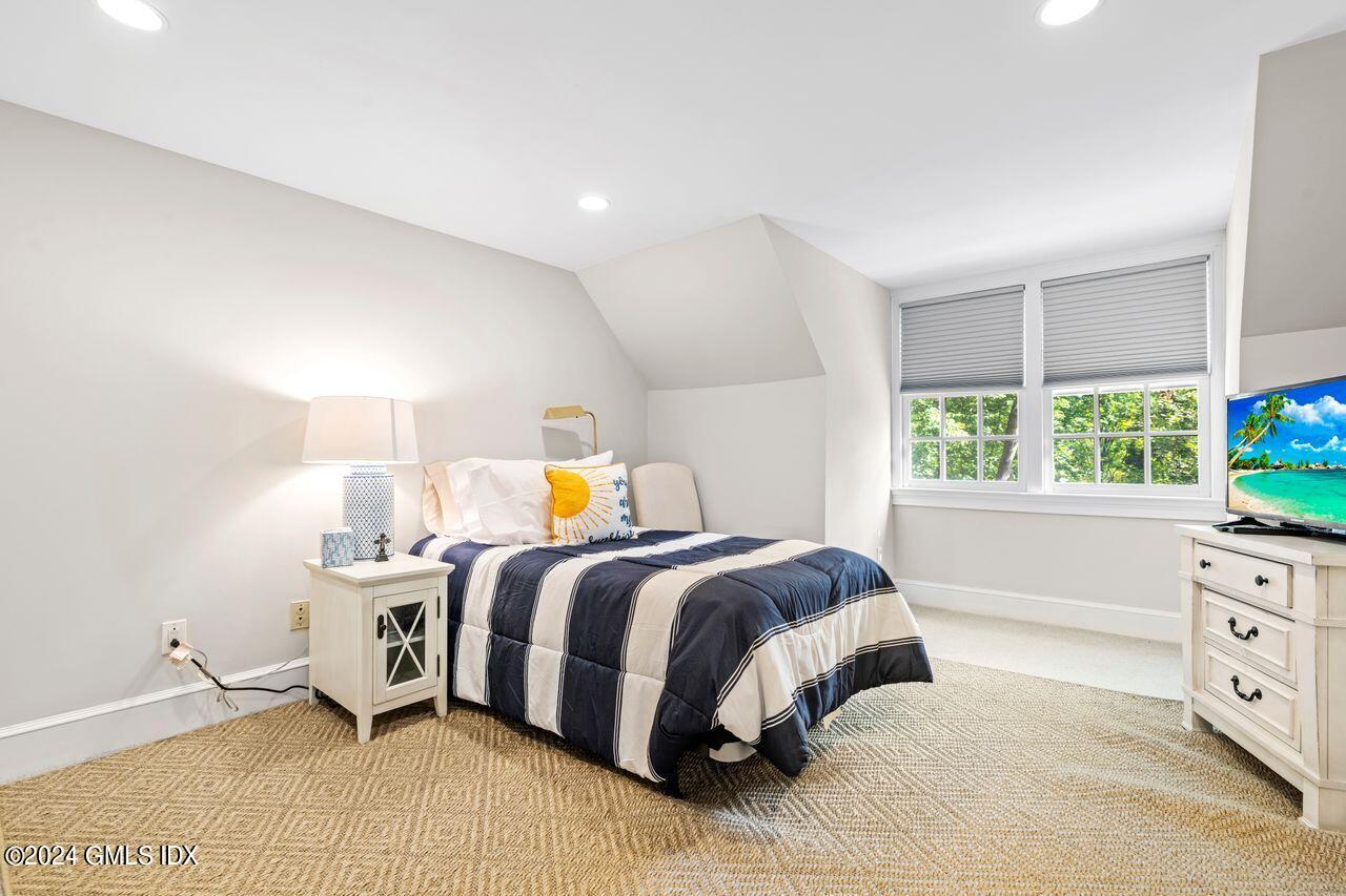 43 Maple Avenue, Unit 2 Greenwich, CT 06830 - Photo 9 of 17 a bed room with a bed and a window