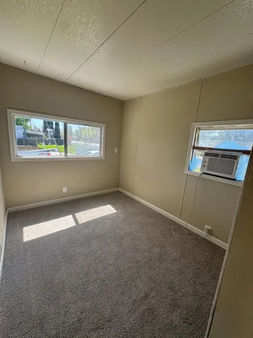 a view of an empty room with a window