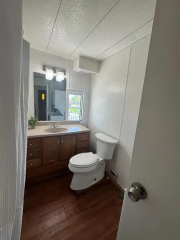 a bathroom with a mirror and a shower