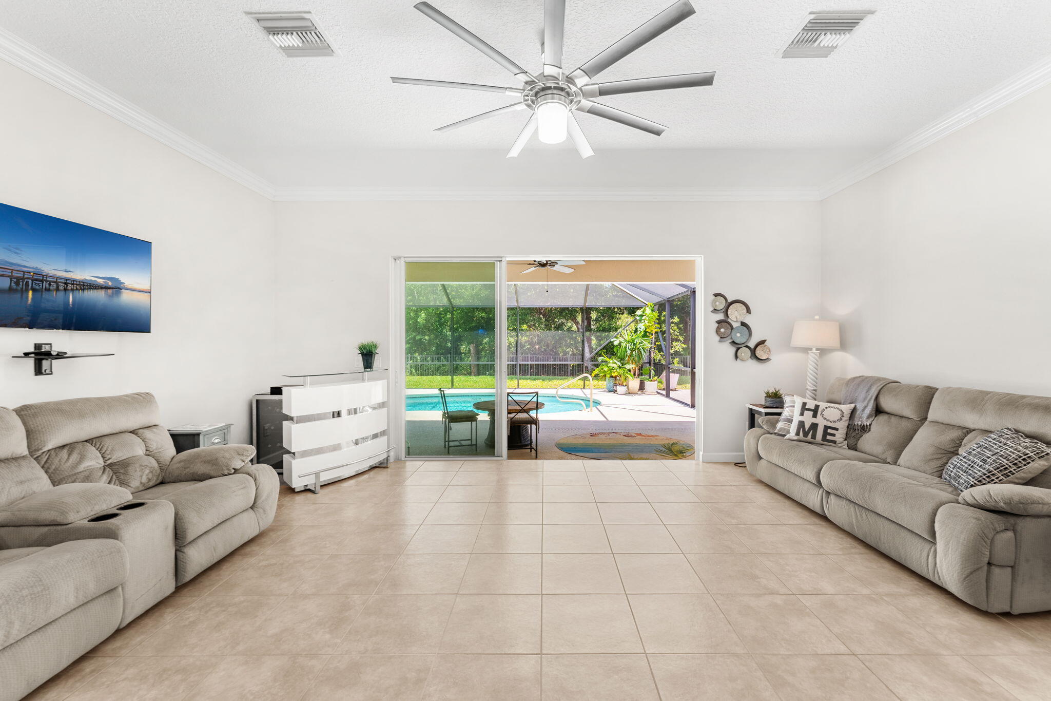 7657 Fieldstone Ranch Square Vero Beach, FL 32967 - Photo 14 of 52 a living room with furniture and a large window