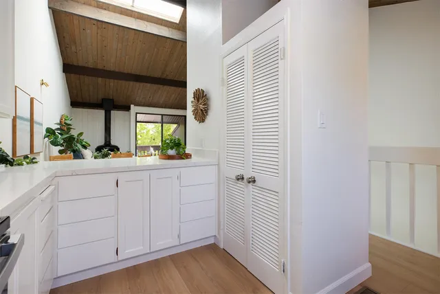a view of a kitchen from a hallway