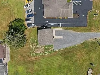 a view of a backyard with table and chairs