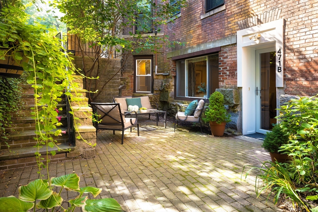 471 Washington Street, Unit B Brookline, MA 02446 - Photo 1 of 10 a view of a house with backyard and sitting area