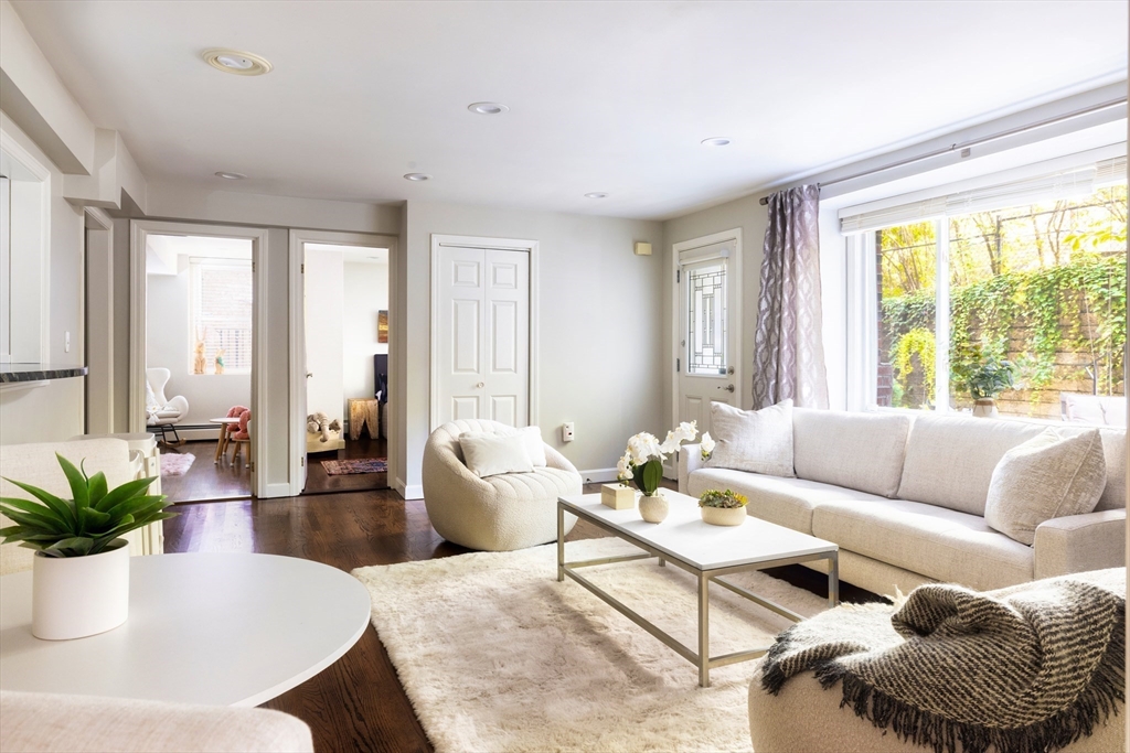 471 Washington Street, Unit B Brookline, MA 02446 - Photo 3 of 10 a living room with furniture and a large window