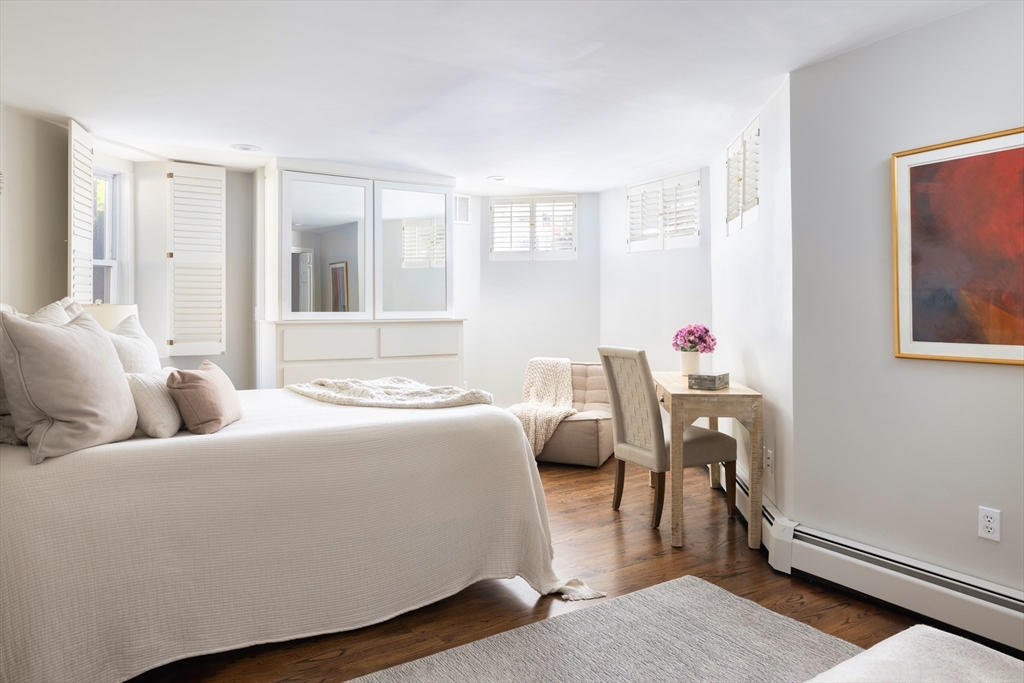 471 Washington Street, Unit B Brookline, MA 02446 - Photo 4 of 10 a bedroom with bed and a window