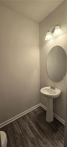 a bathroom with a toilet and a sink