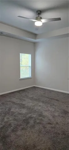 a white toilet sitting next to a shower