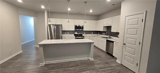 a empty closet with wooden floor