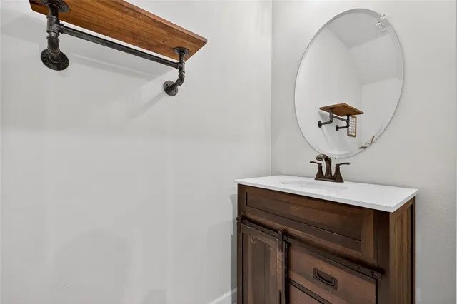 a view of a chair and tables in the garden