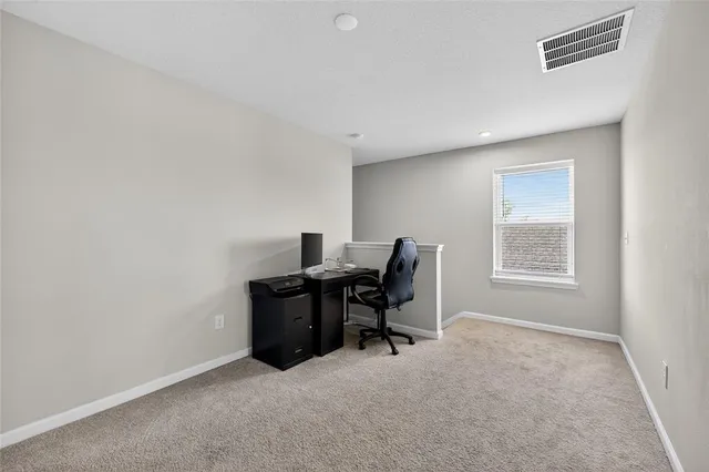 a bedroom with a bed and a ceiling fan