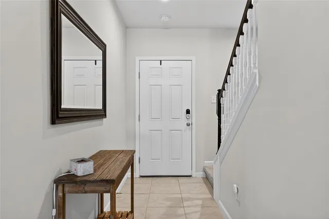 a view of a dining room with furniture and a window