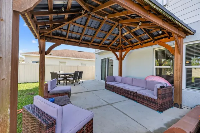 a outdoor living space with patio furniture and a garden