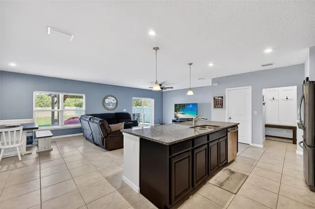 a kitchen with a stove a sink a counter top space and appliances
