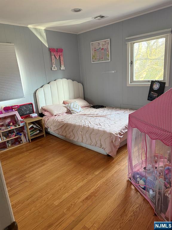 768 Dearborn Street Teaneck, NJ 07666 - Photo 6 of 10 a bedroom with a bed and a tv on table