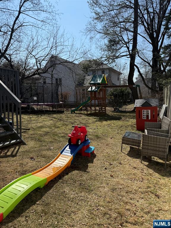 768 Dearborn Street Teaneck, NJ 07666 - Photo 9 of 10 a backyard of a house with yard fire pit and outdoor seating