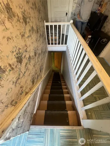 a view of entryway with wooden floor