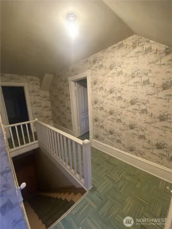 a view of balcony with wooden floor
