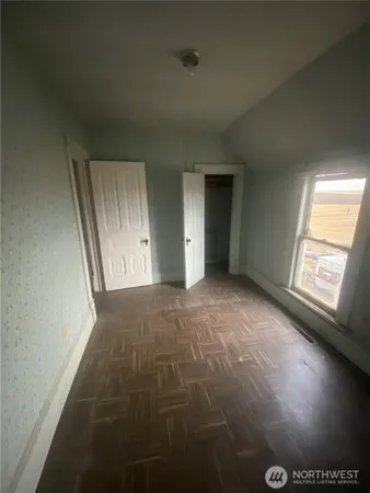 an empty room with windows