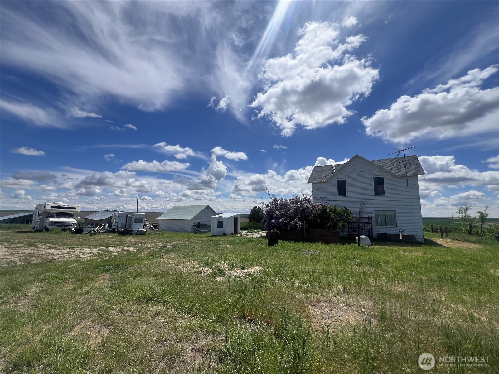 1225 North Marcellus Road Ritzville, WA 99169 - Photo 27 of 40 a view of a house with a big yard and large trees