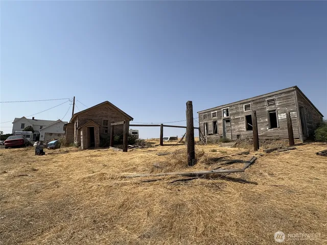 a big house with large windows and a yard