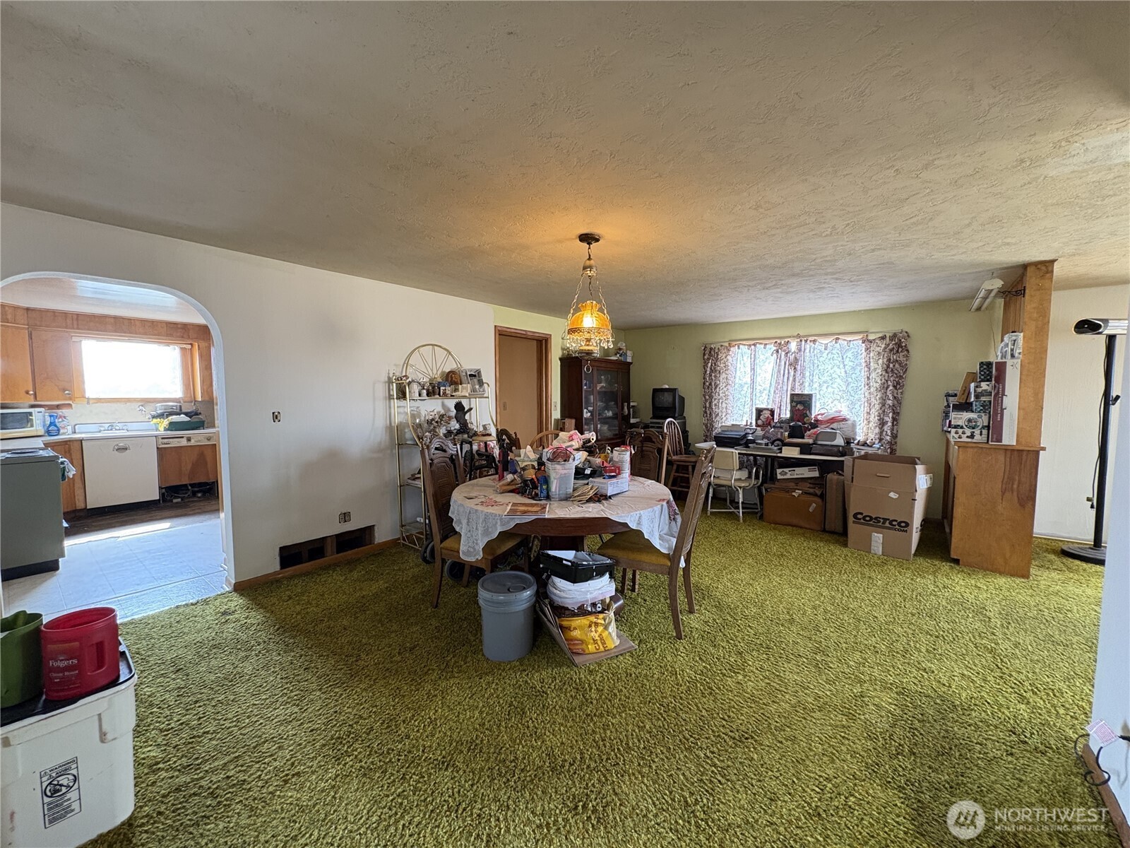 1225 North Marcellus Road Ritzville, WA 99169 - Photo 7 of 40 a living room with furniture and a dining table with kitchen view