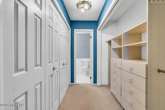 a view of a hallway with closet